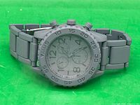 Front view of Merona analog wristwatch showing dial, bezel, and bracelet