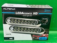 Front of sealed Alpena LEDAccentz HD kit box showing two light bars and 32 LED callout