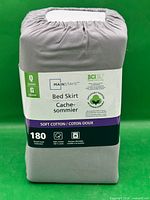 Front view of packaged Mainstays queen bed skirt