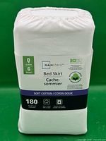 Front view of packaged Mainstays queen bed skirt showing brand, size, material