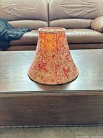 Front angled view of lamp shade exterior on table