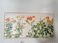 Full view of framed floral canvas on wall