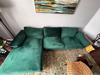 Overall view of green sectional with chaise