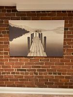 Front view of canvas on brick wall