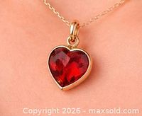 Pendant shown on neck to illustrate size and appearance