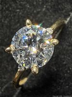 Top view of ring showing round lab diamond in prong setting