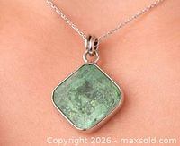 Pendant on chain showing overall look and scale