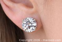 Stud earring worn in ear showcasing size and setting