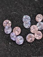 Close view of loose cubic zirconia stones showing colour and faceting