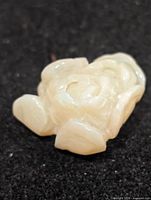 Front view of carved opal showing shape and color