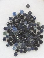 Close-up of loose blue sapphires showing color and cut