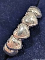 Close-up side angle of ring showing heart details