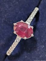 Top view showing ruby centre stone and CZ shoulders