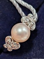 front view showing pearl and diamond scroll sides