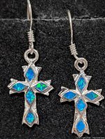 Front view of both earrings showing cross design and opalite inlay
