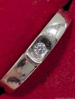 Close-up of CZ stone set in silver band