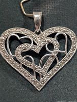 Full view of silver diamond heart pendant front