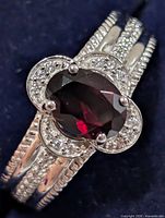 Top view showing garnet, CZ halo, split shank detail