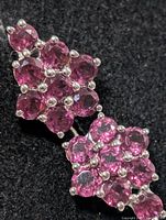 close-up of front showing garnet clusters