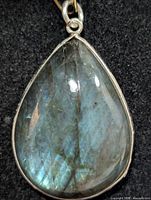 Front view of teardrop labradorite pendant in silver bezel