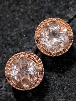 front view of morganite stud earrings showing round center stones and halo setting