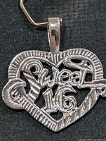 Front view showing Sweet 16 script and heart shape