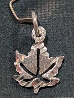 Front view of silver maple leaf pendant