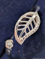 Close-up of leaf motif on sterling silver ring