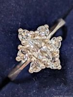 Top view showing marquise centre stone and surrounding round stones