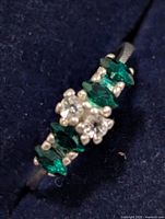 Front view showing marquise green stones and clear stones