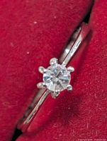 Close-up of stone and prongs on silver-tone ring