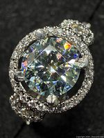 Close-up of ring top showing moissanite and CZ halo