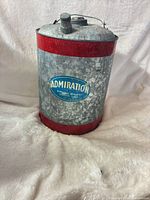 Front view showing blue Admiration label, red bands, spout cap and handle
