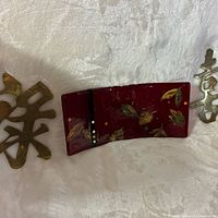 Overall view showing fused glass tray centred between two brass calligraphy plaques