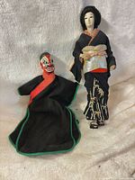 Geisha doll and rod puppet side by side
