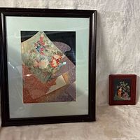 Large and small framed Asian motif prints