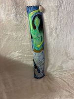 Entire driftwood artwork showing painted mermaid figure and shell accent