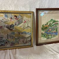 Both framed prints side by side showing relative size and frame colours