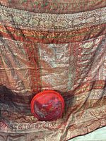 Full view of brocade textile with one pillow for scale