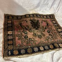Front view showing full rug, colors, pattern and wear