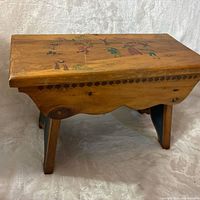 Top view showing painted folk art scene and wood tone