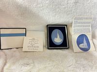 Full set showing presentation case, outer sleeve, certificate and leaflet
