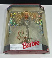 Front angled view of boxed 1992 Happy Holidays Barbie showing gown and packaging