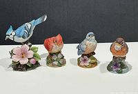 All four Andrea by Sadek porcelain bird figurines side by side