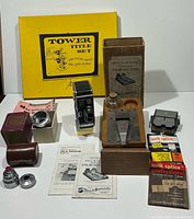 Overview of full lot showing camera, splicers, lens, title set, tapes and manuals