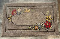 Full view of hooked rug showing entire design and colours