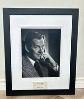 Full view of framed signed portrait photograph