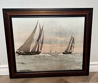 Full view of framed photograph showing schooners and frame style