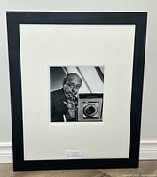 Full view of framed photograph showing frame and mat