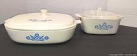 Rectangular and square CorningWare casseroles with lids, blue Cornflower motif visible